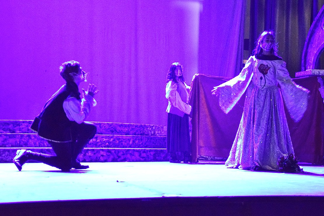 Before becoming the Beast, the prince (played by Pablo Zeitune) begs the Enchantress (played by Abigail Weintraub), whom he was mean to, for mercy.