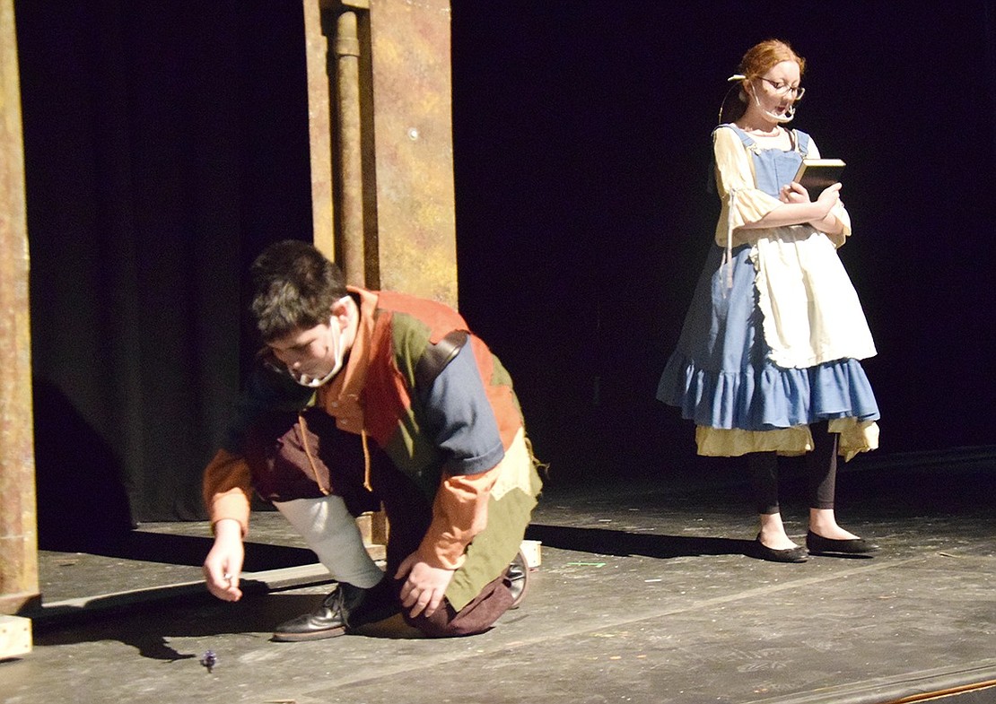 Belle (played by Hannah Levine) confesses her insecurities to her father Maurice (played by Rory Mayer) as he twiddles with his inventions.