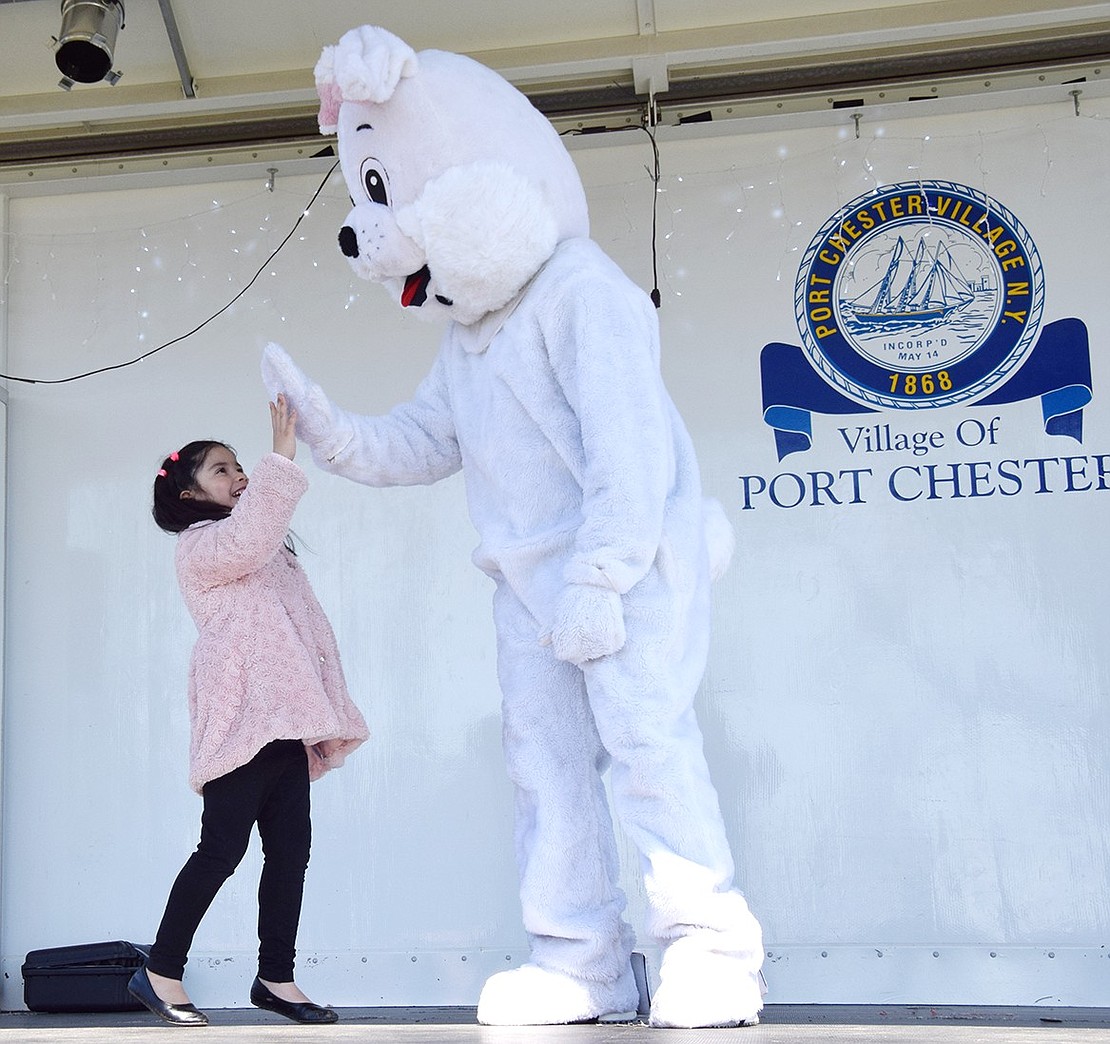 John F. Kennedy Elementary School 6-year-old Andrea Gonzalez is so excited to meet the Easter Bunny that she couldn’t help but run up to give them a high-five.