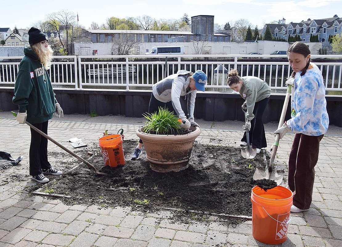 Laura Gunlogson, center, daughters Ella, 17, at left, and Avery, 14, of Harrison and Jenna Conti, 23, of Greenwich tackle a major planting project on Saturday, Apr. 23 at the walkway along the Byram River organized by the Port Chester Beautification Commission. They are members of The Cap Cares Volunteer Rewards Program which started in October 2021. That group, affiliated with The Capitol Theatre, paired up with the Beautification Commission for Saturday’s Community Planting & Cleanup Day sponsored by the Town of Rye.