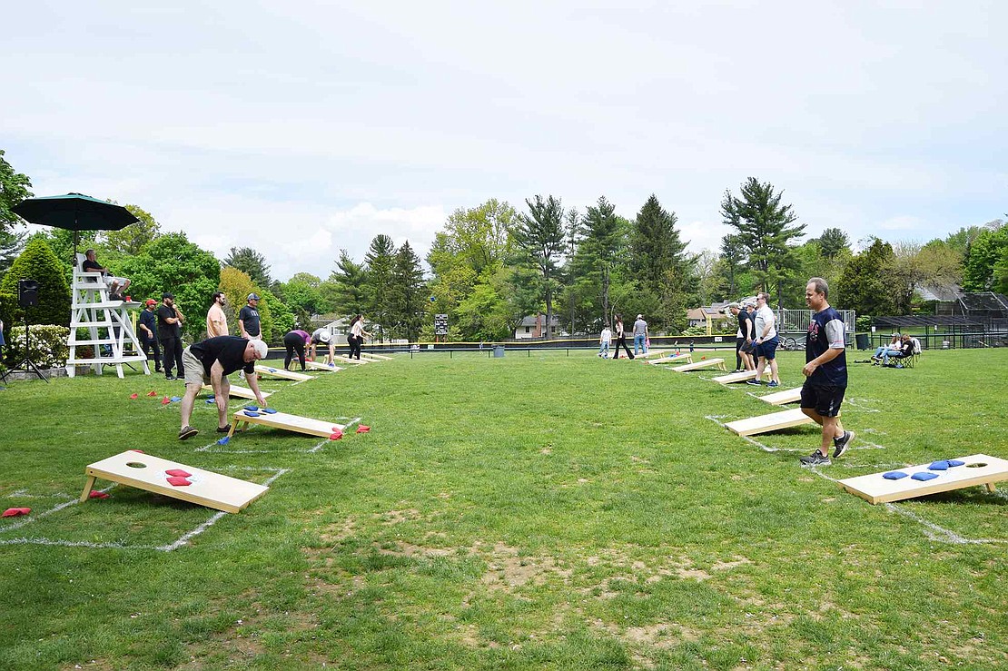 Dozens of Rye Brook residents take advantage of the picturesque day on Saturday, May 14, to take part in some friendly competition at the Village’s first community cornhole tournament at Pine Ridge Park. In all, 11 adult and six youth teams turned on their bean bag tossing skills to vie for trophies.