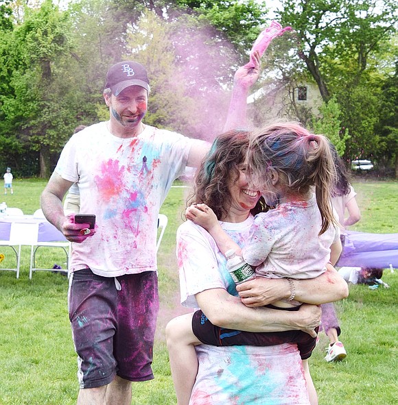 As Windsor Road resident Jessica Andruk dances around with her 4-year-old son Oliver, her husband Michael makes the moment even more magical by sprinkling pink dust around them.