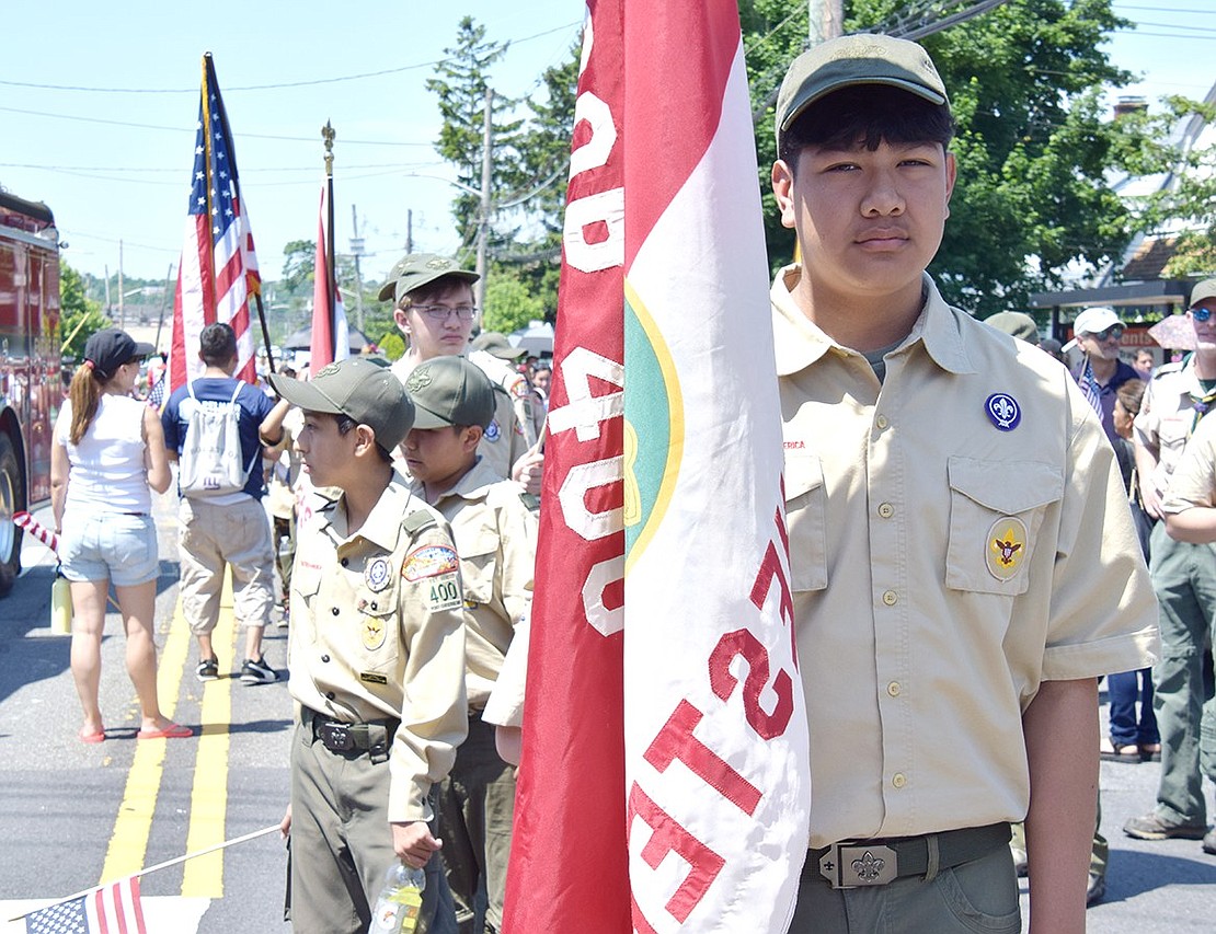 Chris Genis, a 14-year-old White Plains resident with Port Chester BSA Troop 400, stands at the front of his cohort before the parade begins, preparing to lead his peers as a flag bearer down Westchester Avenue.