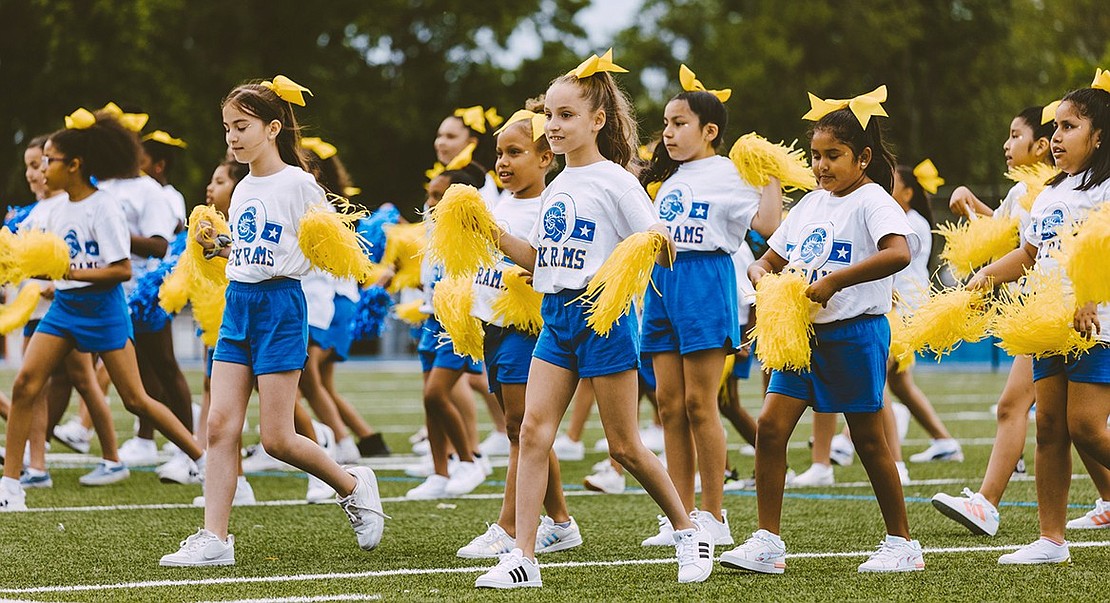 The animated John F. Kennedy School spirit squad in action on the field.