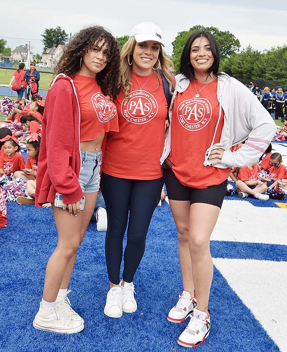 A family affair: Olivia, 16, a sophomore at Port Chester High School (left), her sister Kayla, 24, (right) and their mom, Sandra, are all decked out in Park Avenue School attire. Kayla, a Park Avenue alum, led the school’s spirit squad through their routine.