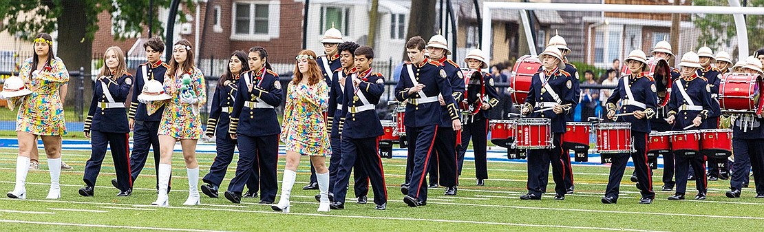 The Port Chester High School Marching Band marches out onto the field.