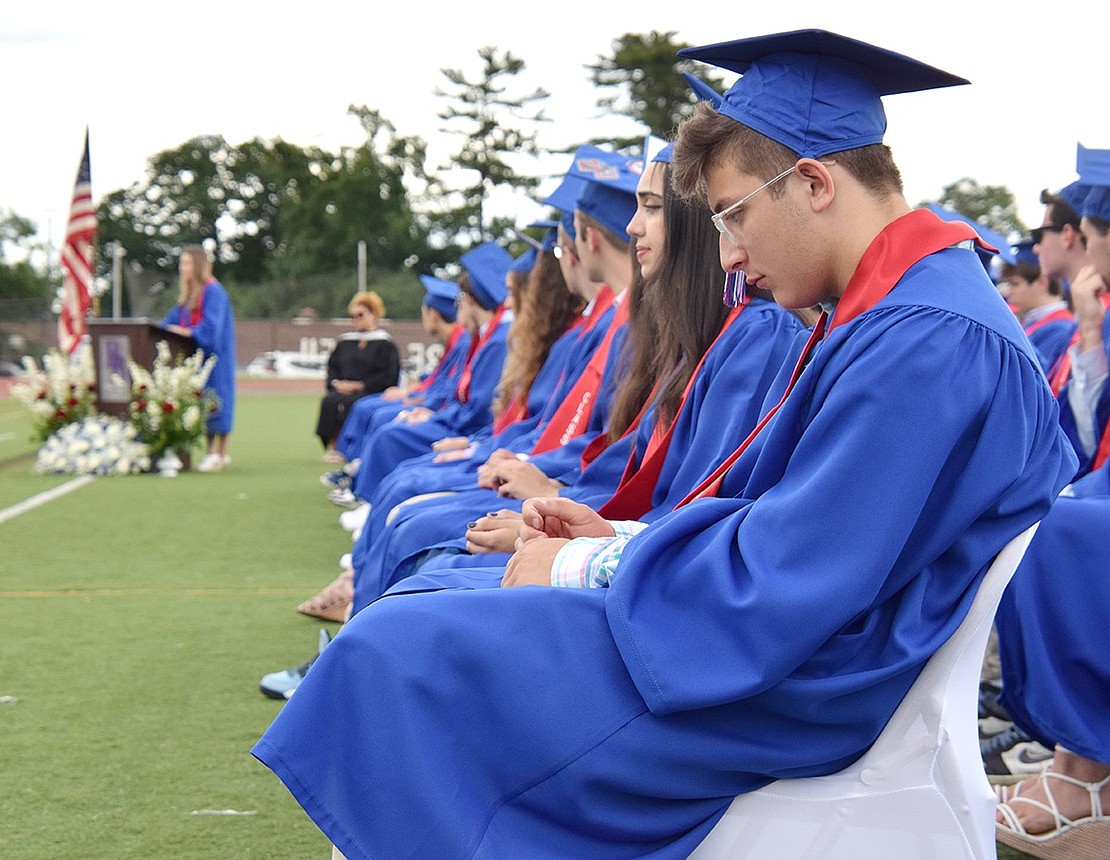 Soon-to-be graduate Frank Casino Jr. listens pensively as speakers encourage the class with words of reflection and hope for the future.