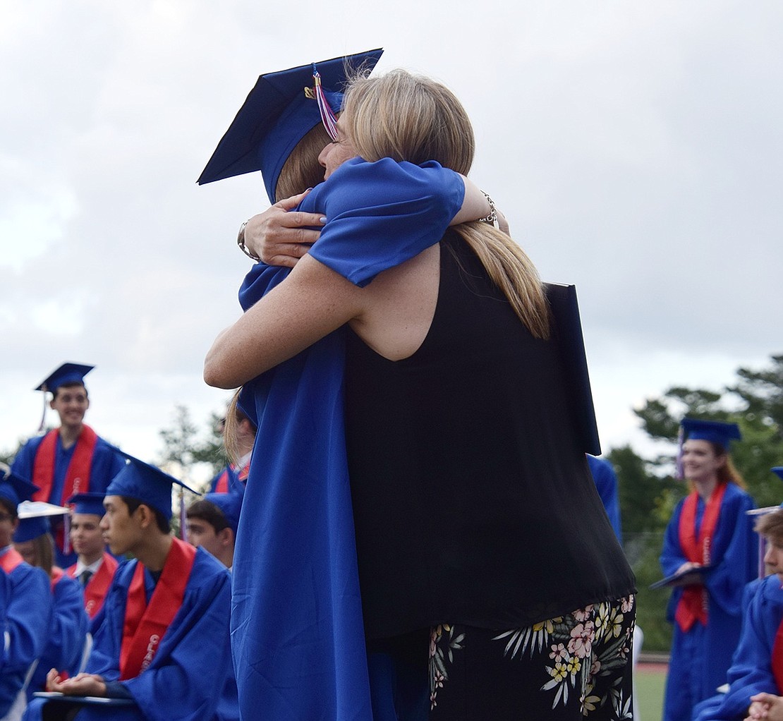 As a Blind Brook High School math teacher, Cindy Zahl was able to step in and give her daughter Olivia a big hug along with her diploma during the commencement ceremony.