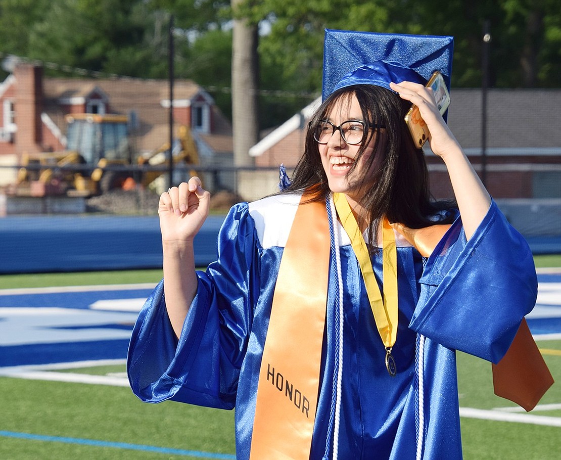 As “Pomp and Circumstance” echoes and students march onto the football field, soon-to-be graduate Jade Miranda holds onto her cap as she smiles and laughs toward loved ones in the audience.