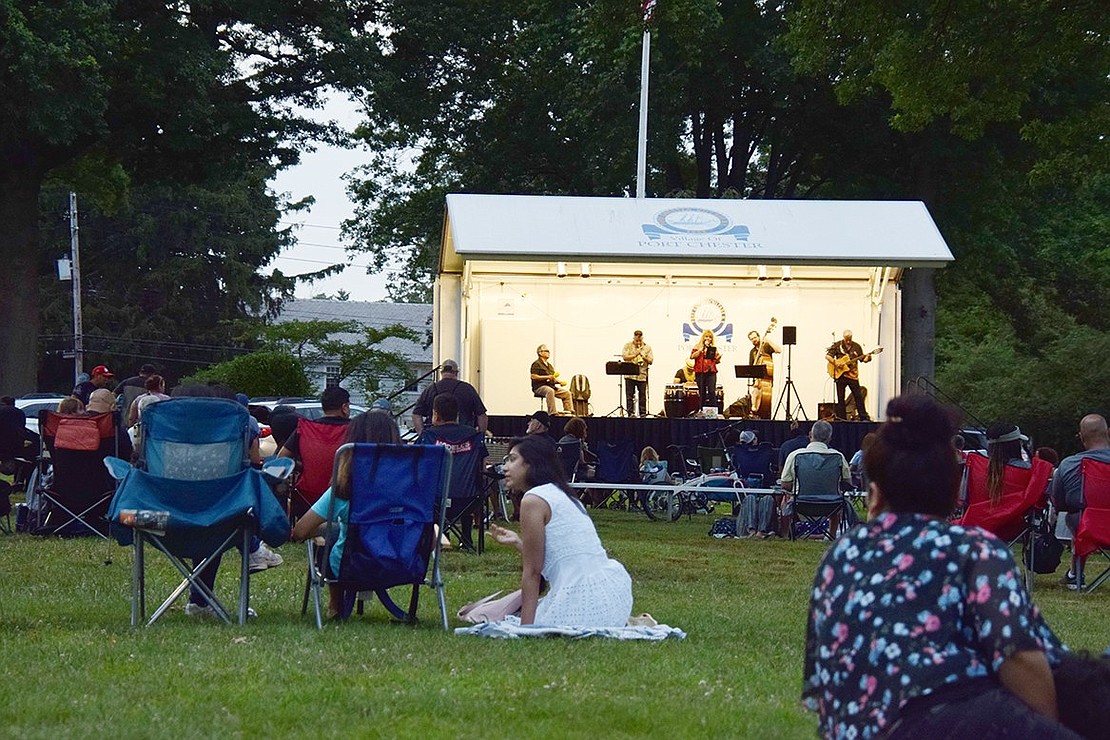 Goza band members jam out as the sun sets on Lyon Park, serenading attendees and the surrounding neighborhood with their Latin-style tunes.