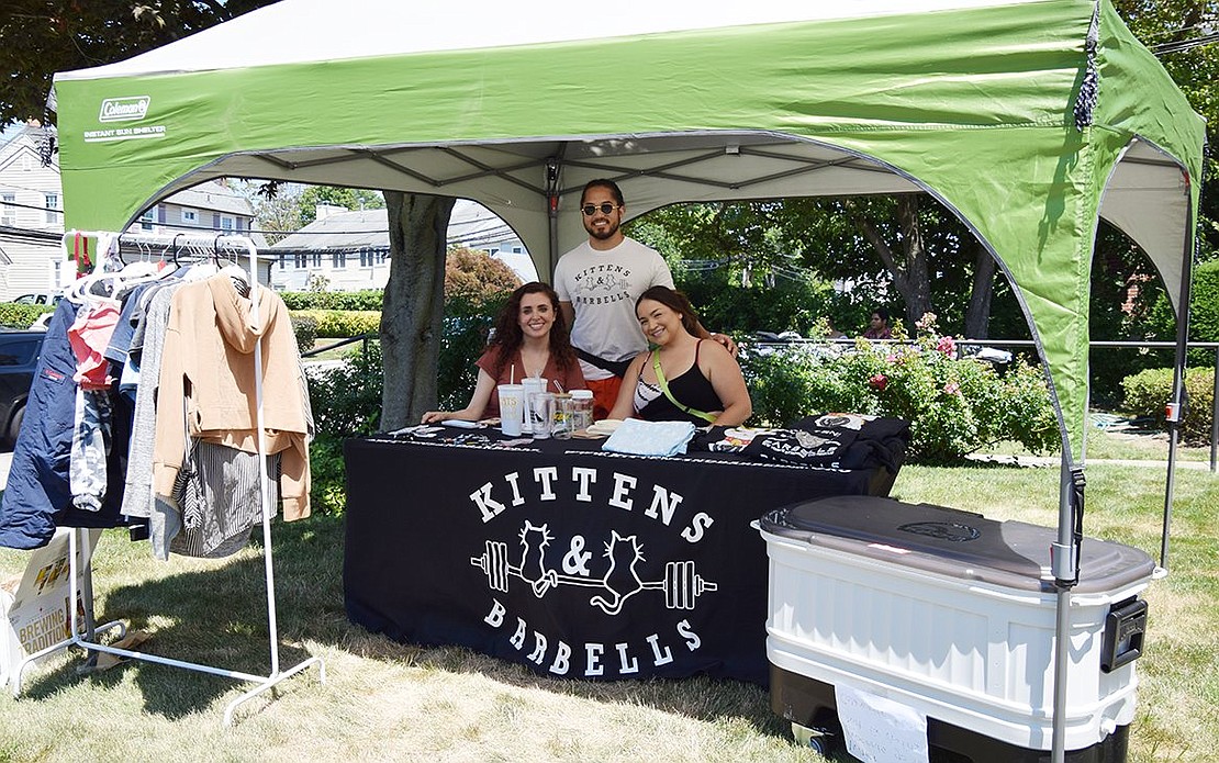 Kittens & Barbells, a metropolitan area cat rescue organization, sells clothing and rescue merchandise in the front yard at 62 Bowman Ave. Manning their booth is Briggitte Dix of Rye Brook (left), who is on the non-profit’s board and fosters kittens as well as chairing the Rye Brook Sustainability Committee which sponsored the Community Tag Sale; Donovan Lee and Kathrine Jorquera of the Bronx.