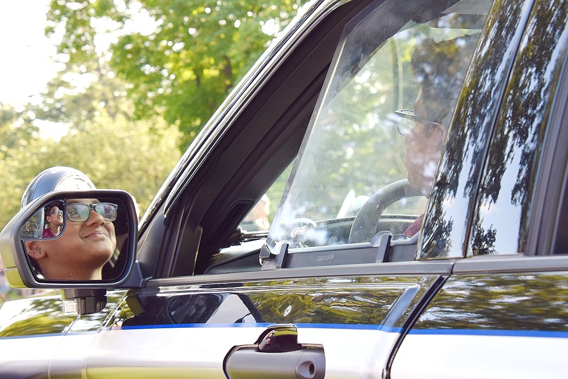 The police car may be parked, but Port Chester Middle School rising seventh-grader Joshua Sam makes cruising around look cool.