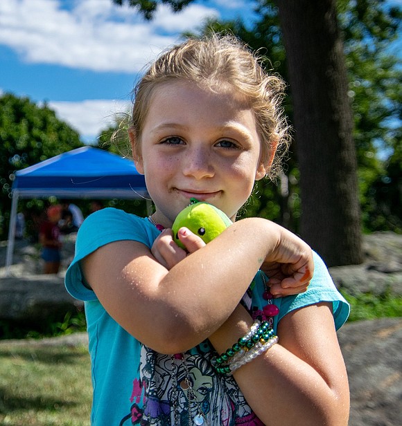 Ryan Allen, 5, absolutely adores her new avocado friend. The King Street Elementary School rising first-grader squeezes the plushie as she runs around and explores Columbus Park—a trek across town from her family’s Glendale Place home.
