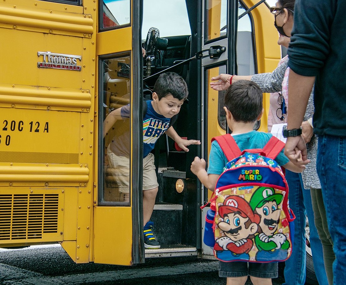 Kindergarten can be scary, but Benjamin Miceli is ready to (literally) jump into his second day at Park Avenue Elementary School. He takes a leap of faith getting off the bus and lands on both feet, with a little help from some school staff standing at the bus door.