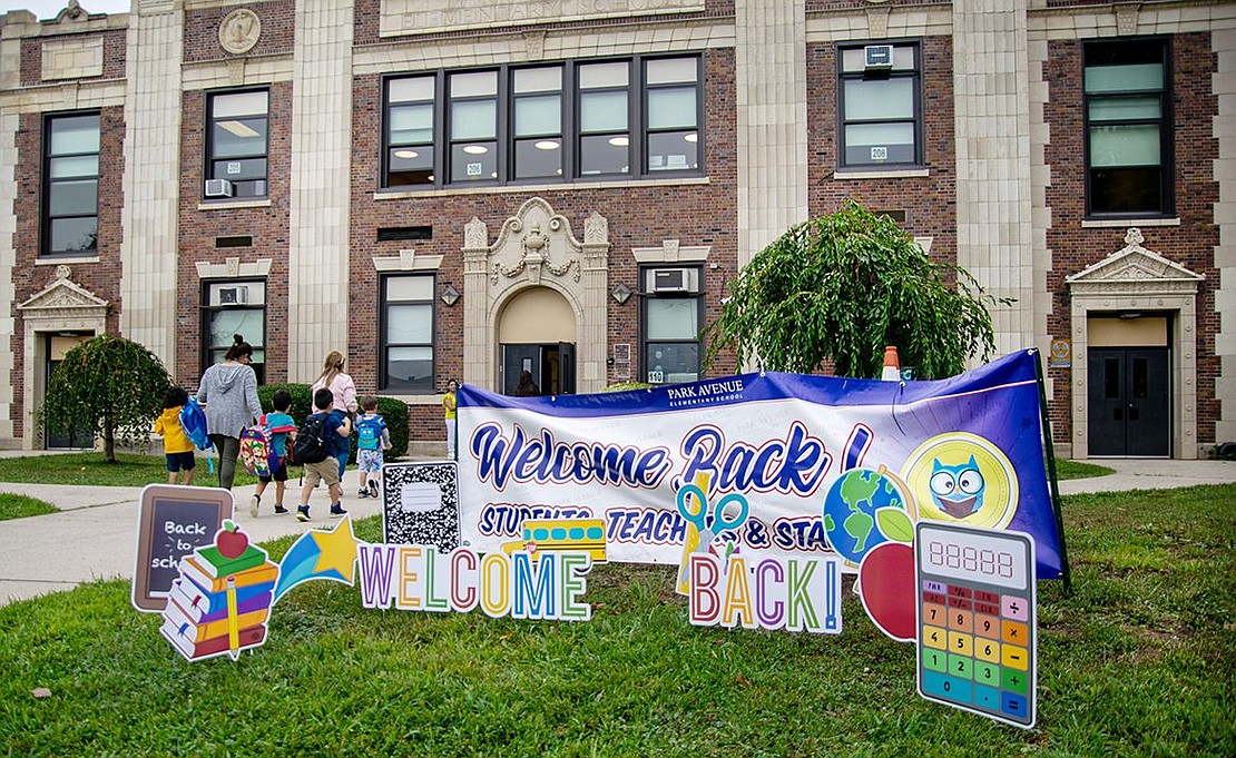 Large canvas signs line the front yard of Park Avenue Elementary School welcoming students back for another scholastic year.