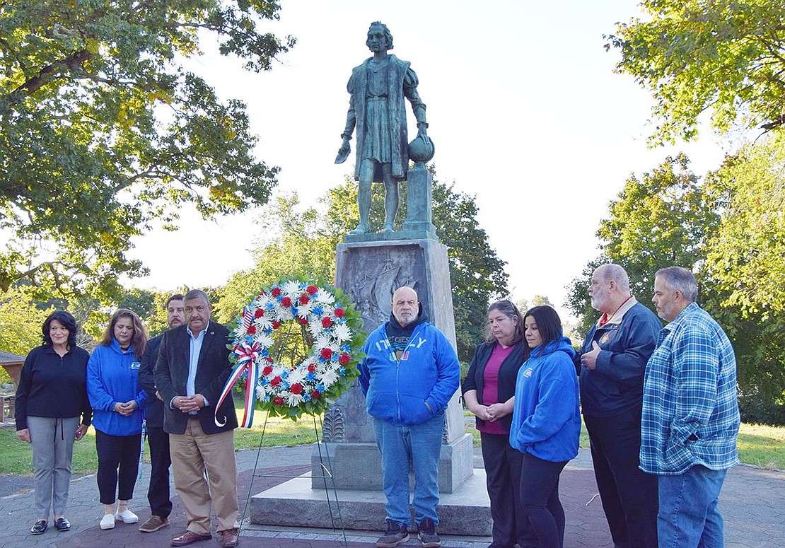 Members of the Port Chester Columbus Day Parade Committee place a wreath in front of the statue of Christopher Columbus up on a hill at Columbus Park off Ryan Avenue on the morning of the parade—Sunday, Oct. 9, and the day before the official holiday celebrating Columbus’s arrival in the Americas on Oct. 12, 1492. From left, Hope Vespia, Debbie Scocchera, Port Chester Trustee Phil Dorazio, Mayor Luis Marino, Mark Scocchera, Toni Sacco, Tricia Gianfransico, Charlie Sacco and Scott LaDore.