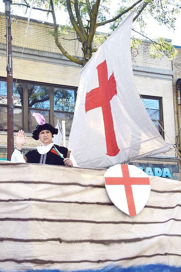 As the grand finale at the end of the Columbus Day Parade, Port Chester resident Nate Casterella waves to the crowd on Westchester Avenue on Sunday, Oct. 9. He portrays Christopher Columbus while riding in the Italian Heritage Club’s masterful float replicating one of the explorer’s iconic ships.