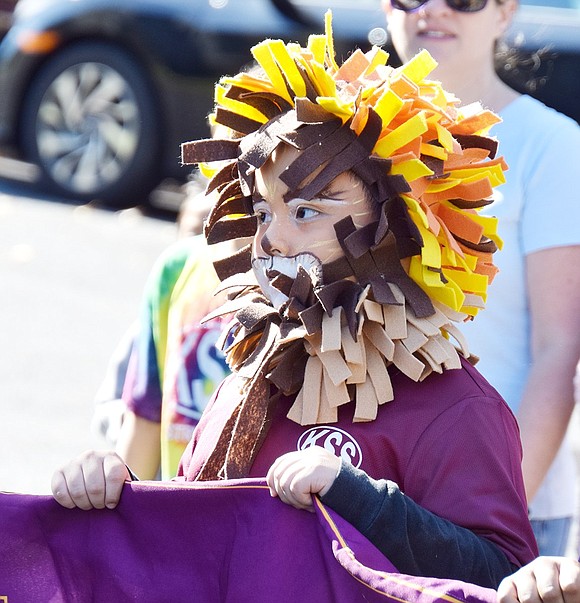 Representing King Street Elementary School as the mascot is a job second-grader Stephano Becerra takes seriously as he stoically leads his peers.