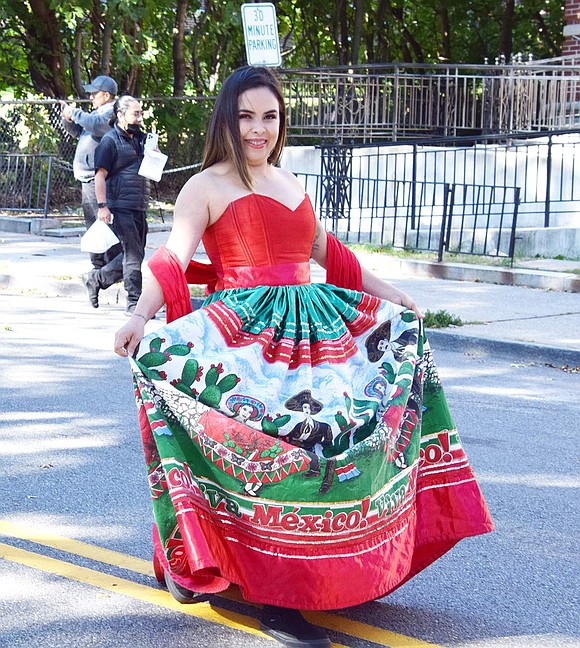 While passing by the Port Chester-Rye Brook Public Library, Spring Street resident Marlen Partida takes a moment to grace the camera with a smile in her Viva Mexico dress.