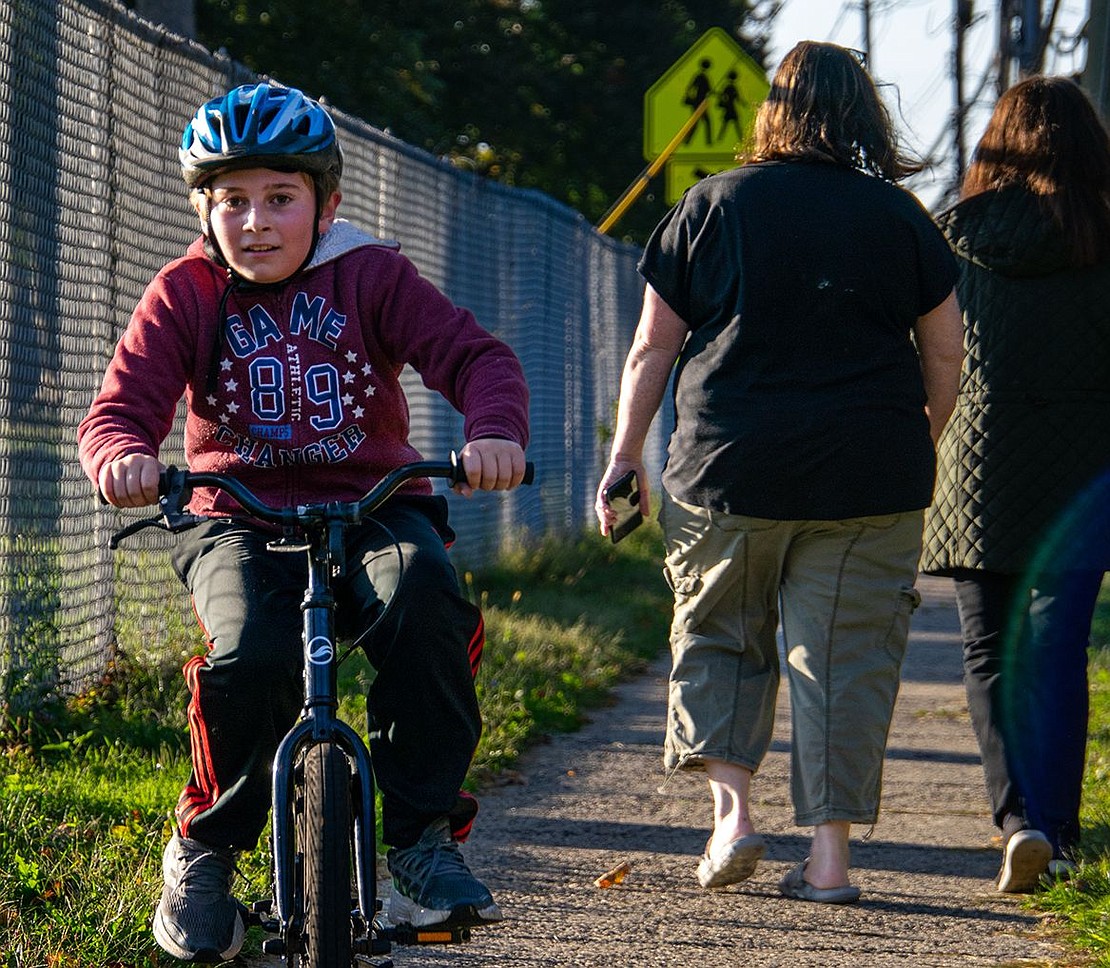 Walk to School Day doesn’t just feature students and their families getting to school by foot—some, like fifth-grader Nicholas Allmashy, rode bikes. The event advocates for safe pedestrian paths in the community.