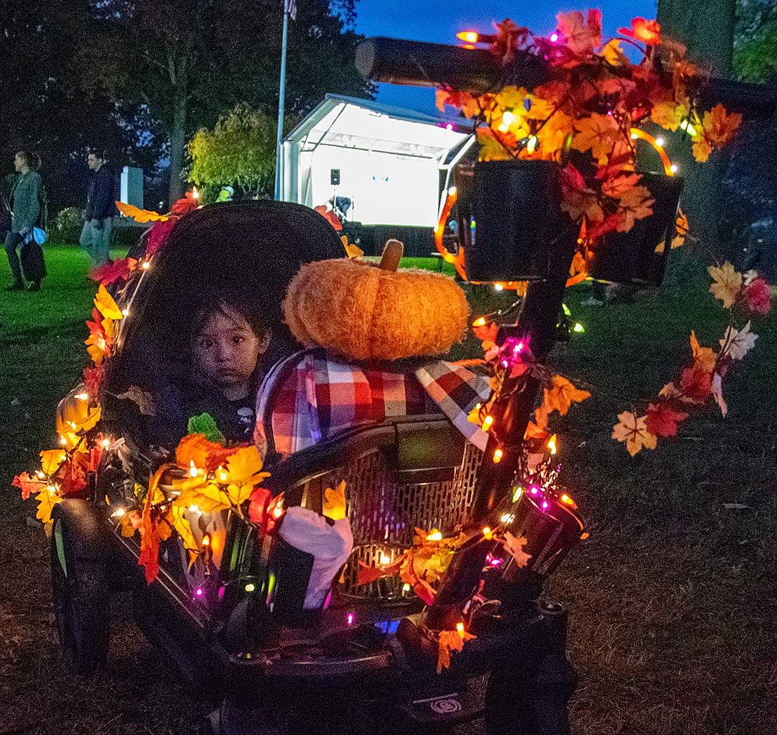 Owen Marquez, 2, sits happily in his decorated stroller, which his mother brought from their Terrace Avenue residence.