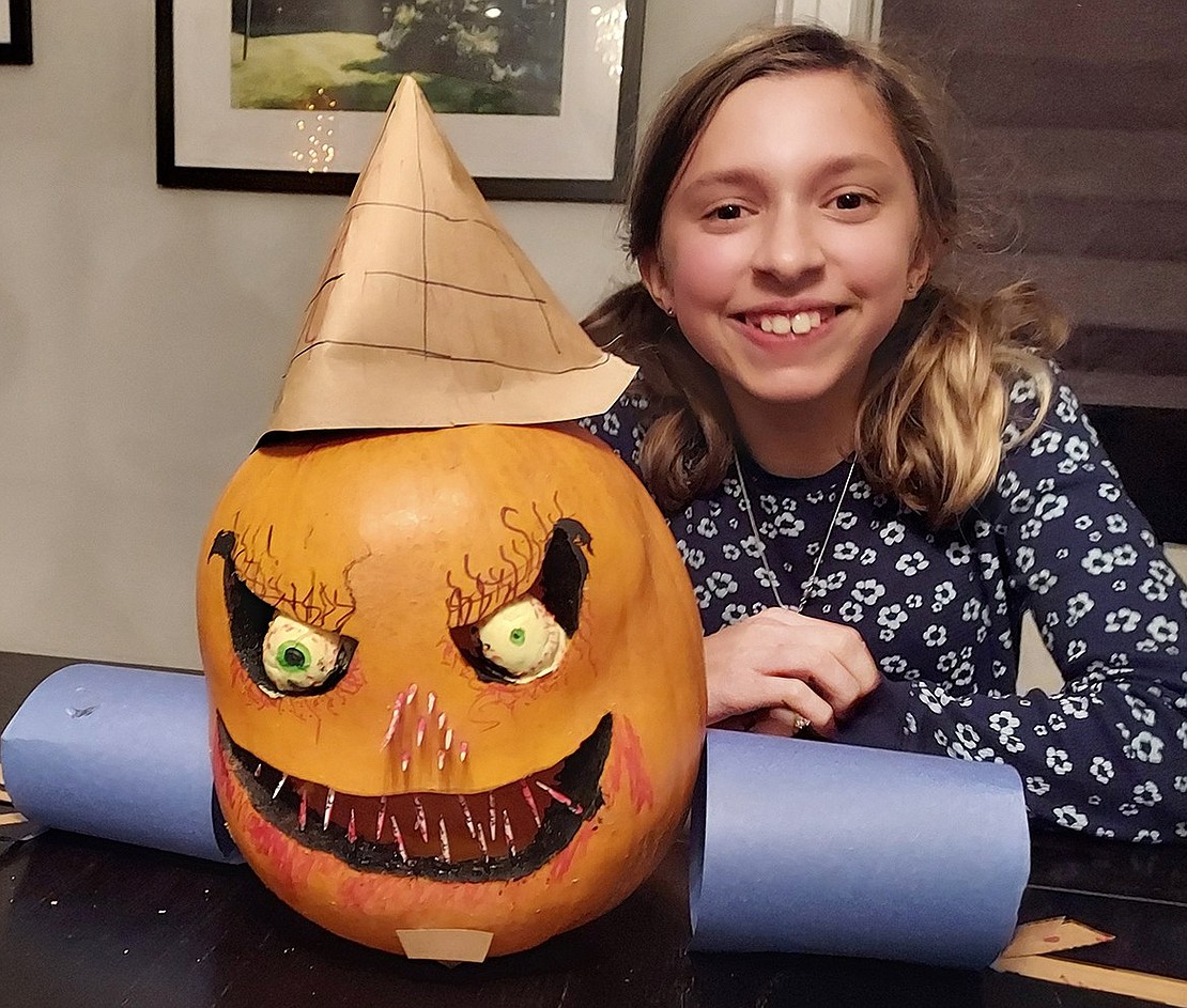 The Rye Brook Recreation Department held its second annual pumpkin decorating contest. All entries were received by Oct. 22 at 9 p.m. With approximately 20 entries, it was very difficult to pick the winners, according to Kathy Laoutaris, recreation supervisor. The winning entries will be displayed at Village Hall, 938 King St. Ava Benoit, 12, of Windsor Road, with the scary pumpkin she decorated which won Rye Brook’s contest. Courtesy of Village of Rye Brook 