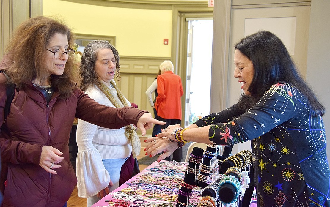 Forget the mannequin, Rye Brook artist Joani Krasne (right) shows Deborah Meer, a resident of the Kingfield development in Rye Brook, how a variety of her handmade bracelets looks on the wrists.