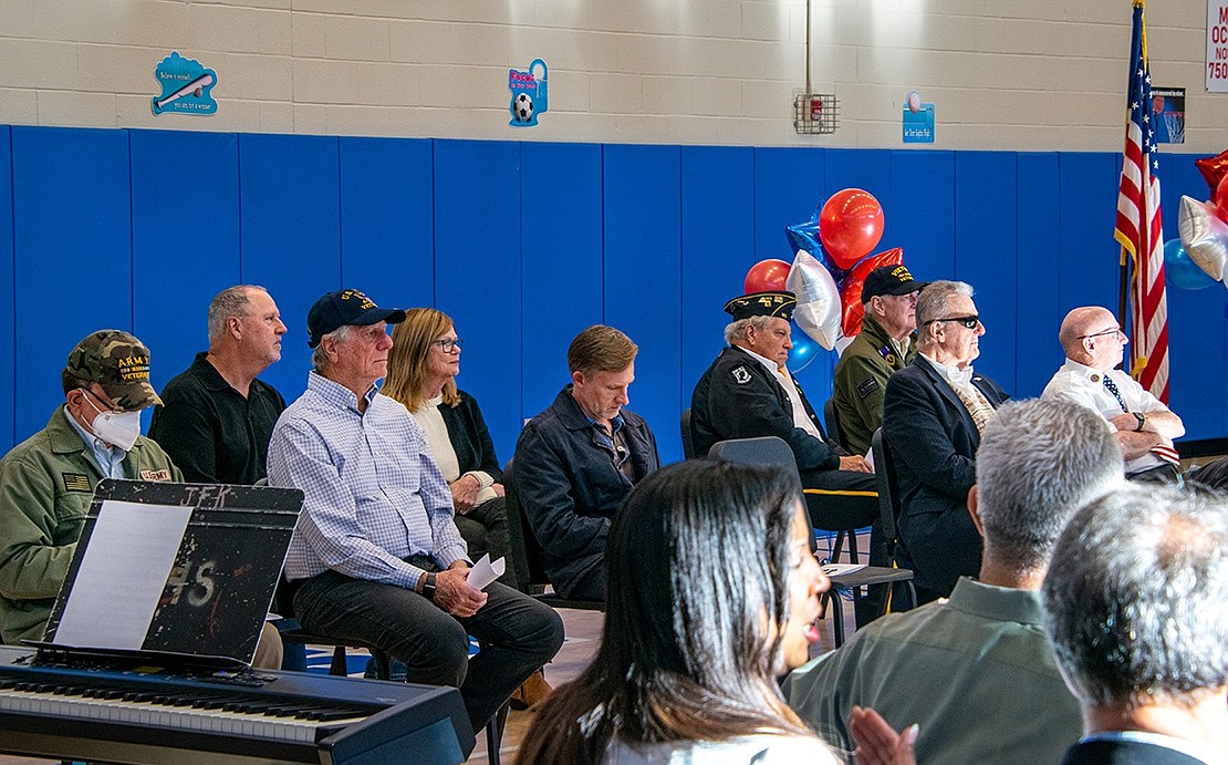 Around a dozen local veterans were invited to King Street Elementary School. They sit in chairs at the front of the building’s gymnasium—the seats of honor for the pending ceremony in recognition of their service.