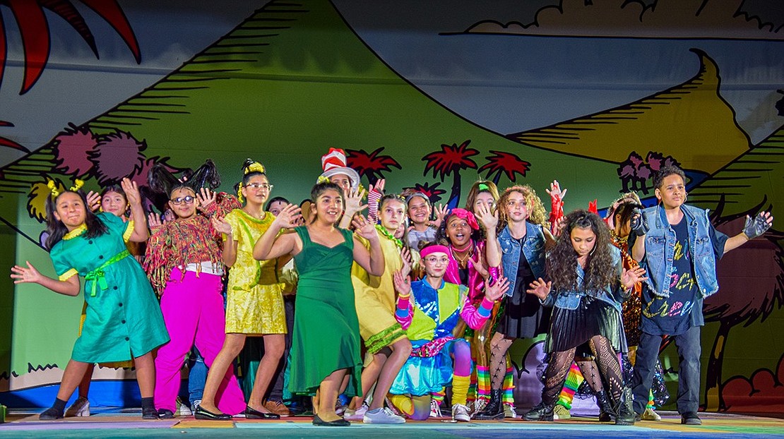 The cast of “Seussical Jr.” performs a number on the stage of Port Chester Middle School’s auditorium.