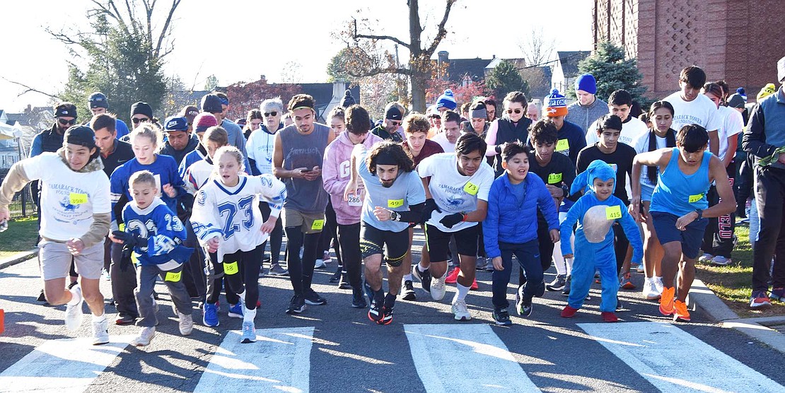 Two hundred twenty-eight people take off from the starting line adjacent to the flagpole at Port Chester High School for the Tamarack Tower Foundation’s Turkey Trot on a sunny Thanksgiving morning. After a year’s hiatus in 2020 due to COVID-19, the 3.5K race benefiting the Port Chester Public Schools was revived last year with renewed interest and continued to draw Port Chester and Rye Brook families and current and former local track stars this year. Port Chester Board of Education President Chrissie Onofrio welcomed runners and started the race, which was sponsored by longtime supporter Arctic Mechanical.