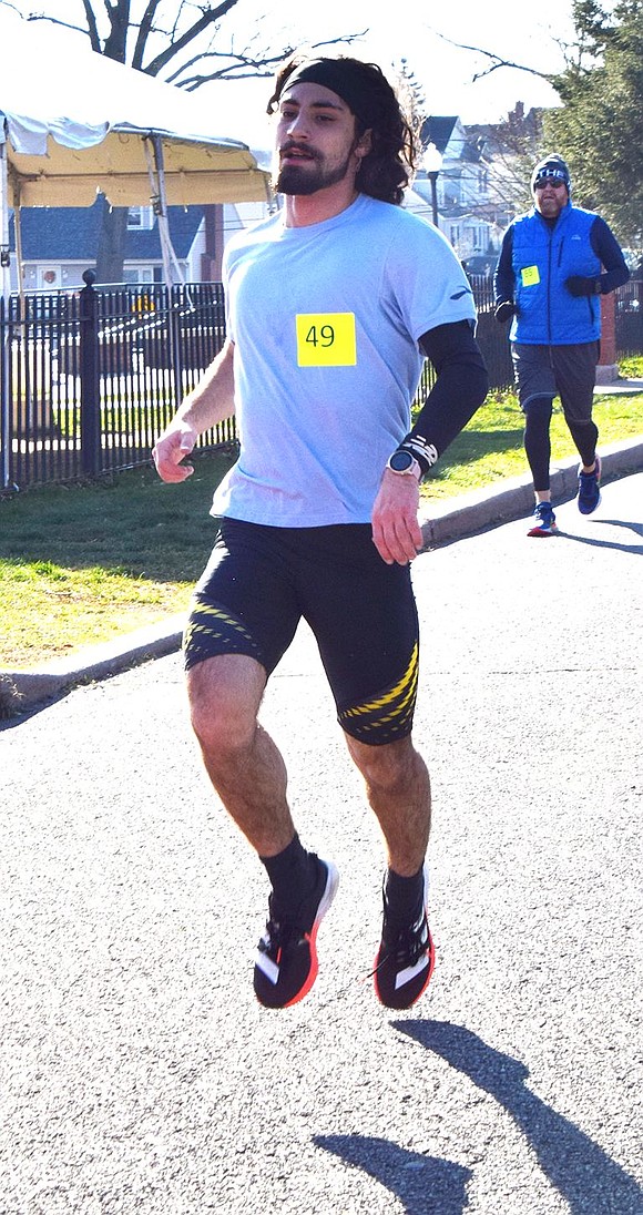 2021 Port Chester High School graduate and long-distance runner Tommy Perrone crosses the finish line first for the second year in a row with a time of 17:07. A track star at PCHS, he now runs for Pratt Institute where he is studying game design.