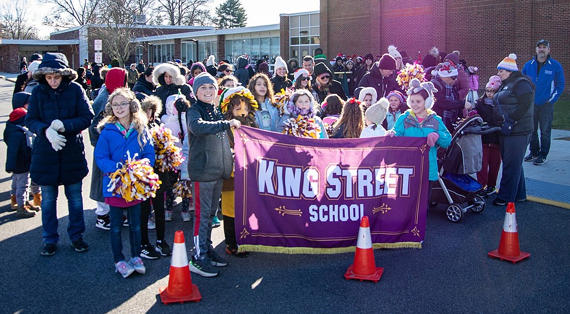 King Street Elementary School students line up in the parking lot of their school, where the parade kicked off, claiming their spot as the first group in the procession.