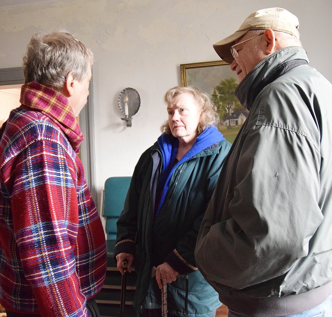 Historian and Port Chester Historical Society member Peter Feinman goes over the inner workings of the Town of Rye and Village of Port Chester with longtime village residents Ann Finegan and Henry Bylicky of North Regent Street. It was their first time visiting the Bush Lyon Homestead.