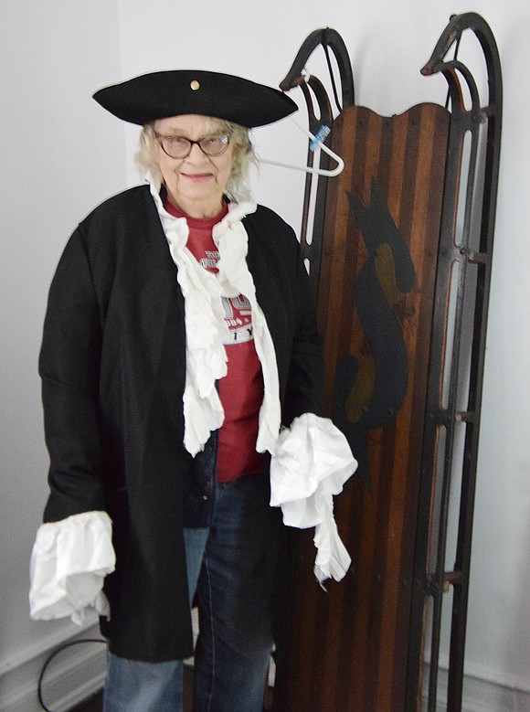 Lifelong Port Chester resident Frances Nurena, who lives across the street from the Bush Lyon Homestead, tries on a Colonial costume for size.