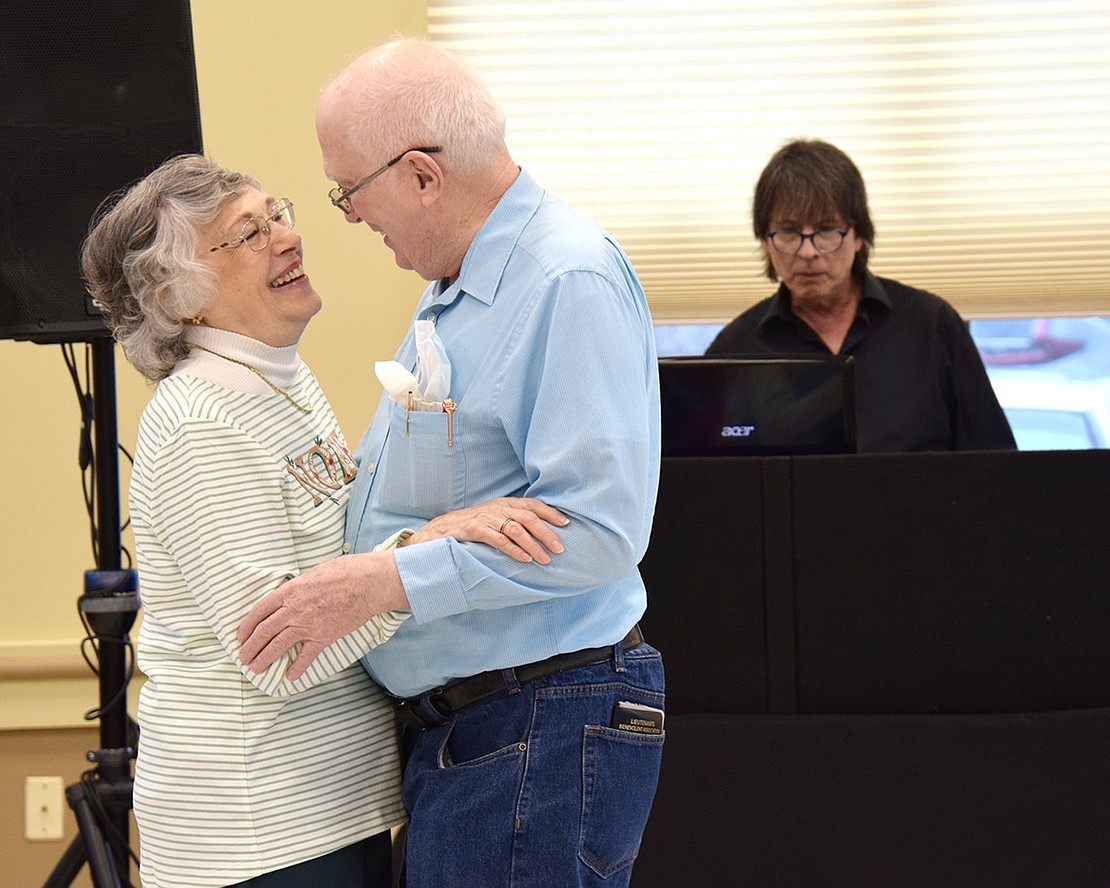 Young love isn’t bound by age. Embracing their 4-year relationship, Port Chester couple Dolores Anselmo, a 78-year-old resident of the Regent Street Senior Apartments, and Leon Russell, a 72-year-old Westchester Avenue resident, romantically dance to Frank Sinatra hits played by DJ Anthony Radice at the Rye Brook Senior Center’s New Year’s party on Tuesday, Jan. 3.