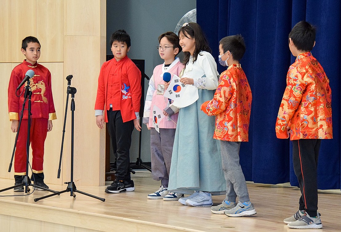 Ridge Street Elementary School students whose families originate from various Asian countries lead the assembly on Wednesday, Jan. 18. They recount their cultures’ traditions and invite students to participate in their presentations.