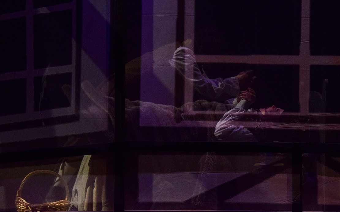 From inside a translucent cottage prop on stage, the Baker (eighth-grader Cassandra Brunetti) slashes the stomach of the Wolf (seventh-grader Andy Montvelisky) after he ate Little Red Riding Hood and her grandmother. In doing so, he frees them from the beast’s innards.
