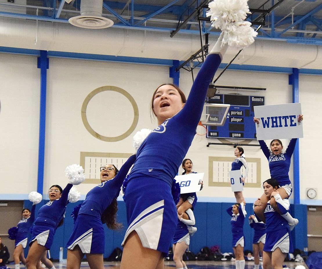 Sophomore cheerleader Morgan Saunders stands in the forefront as the junior varsity team brings an energetic spirit to the crowd.