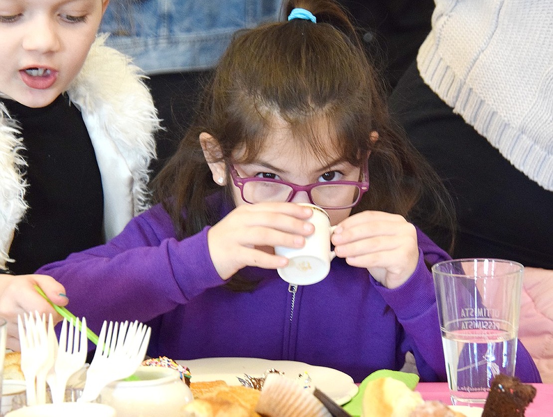 After mixing in all the proper fixings, Park Avenue School first-grader Piper Webber eyes the camera as she sips the perfect cup of tea.