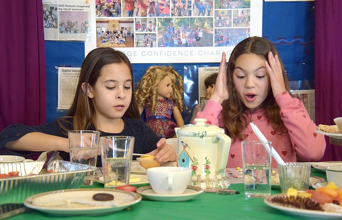 So close! Valentina Castellano (right) gets amped up when she realizes she’s just a few spaces away from winning as she plays bingo next to Julietta Stone. The Ridge Street School fourth-graders positioned their American Girl dolls, Courtney and Samantha, behind them so they could also catch up over tea like old friends.