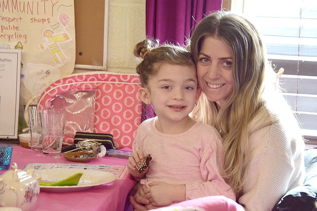 Giada Lio, 4, and her mother Sara Morabito, Port Chester residents, fuel up on baked goods and get ready to take on bingo as a power pair.