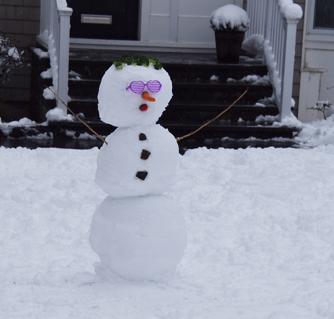 Mackenzie and Isla Weinrub, ages 5 and 3, helped their father David make this cool snowman at 161 Country Ridge Dr.